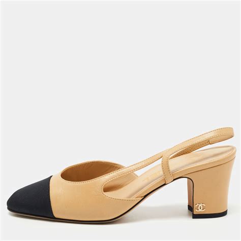 chanel beige and black slingbacks.